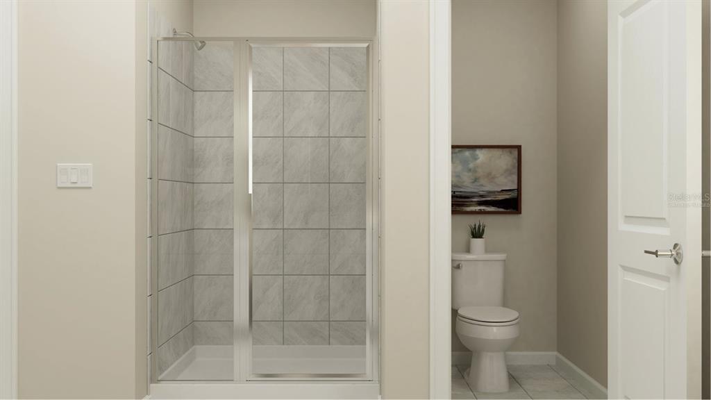 6072 Zen Way Clermont, FL 34714 - Photo 13 of 21 a bathroom with a toilet and a shower