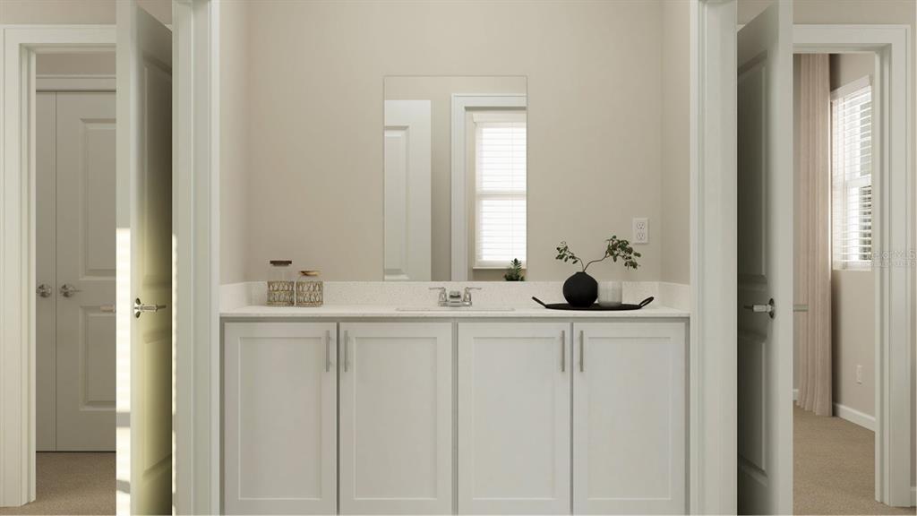 6072 Zen Way Clermont, FL 34714 - Photo 5 of 21 a bathroom with a sink and a mirror