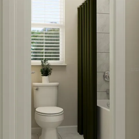 a bathroom with a toilet a sink and a window