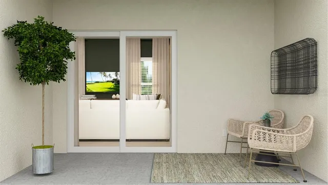 a living room with furniture and a potted plant