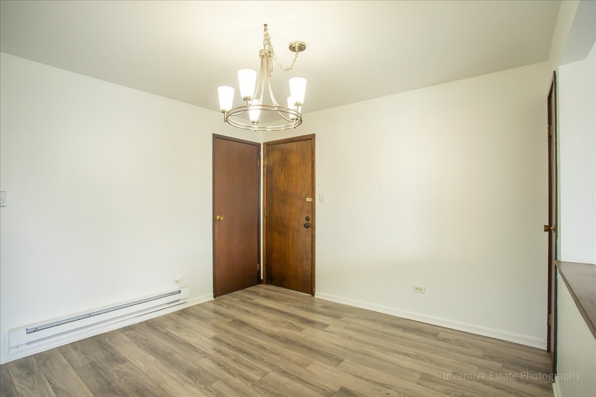 7345 West 85th Place, Unit 3A Bridgeview, IL 60455 - Photo 9 of 21 a view of a chandelier in big room