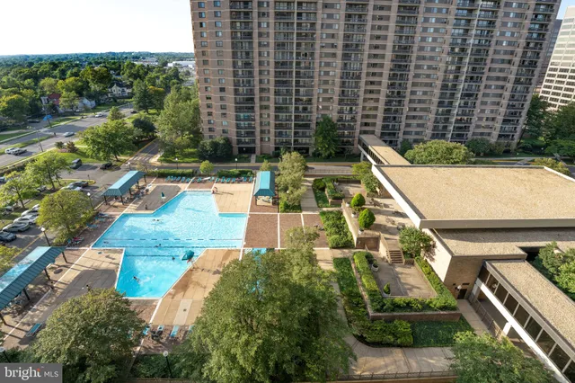 a view of a swimming pool with a patio