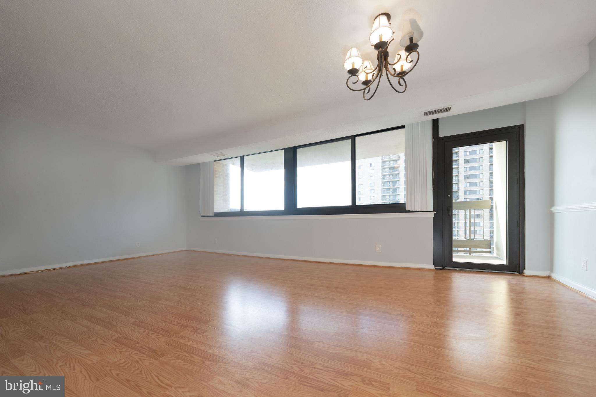 5501 Seminary Road, Unit 1113S Falls Church, VA 22041 - Photo 11 of 43 a view of an empty room with wooden floor and a window