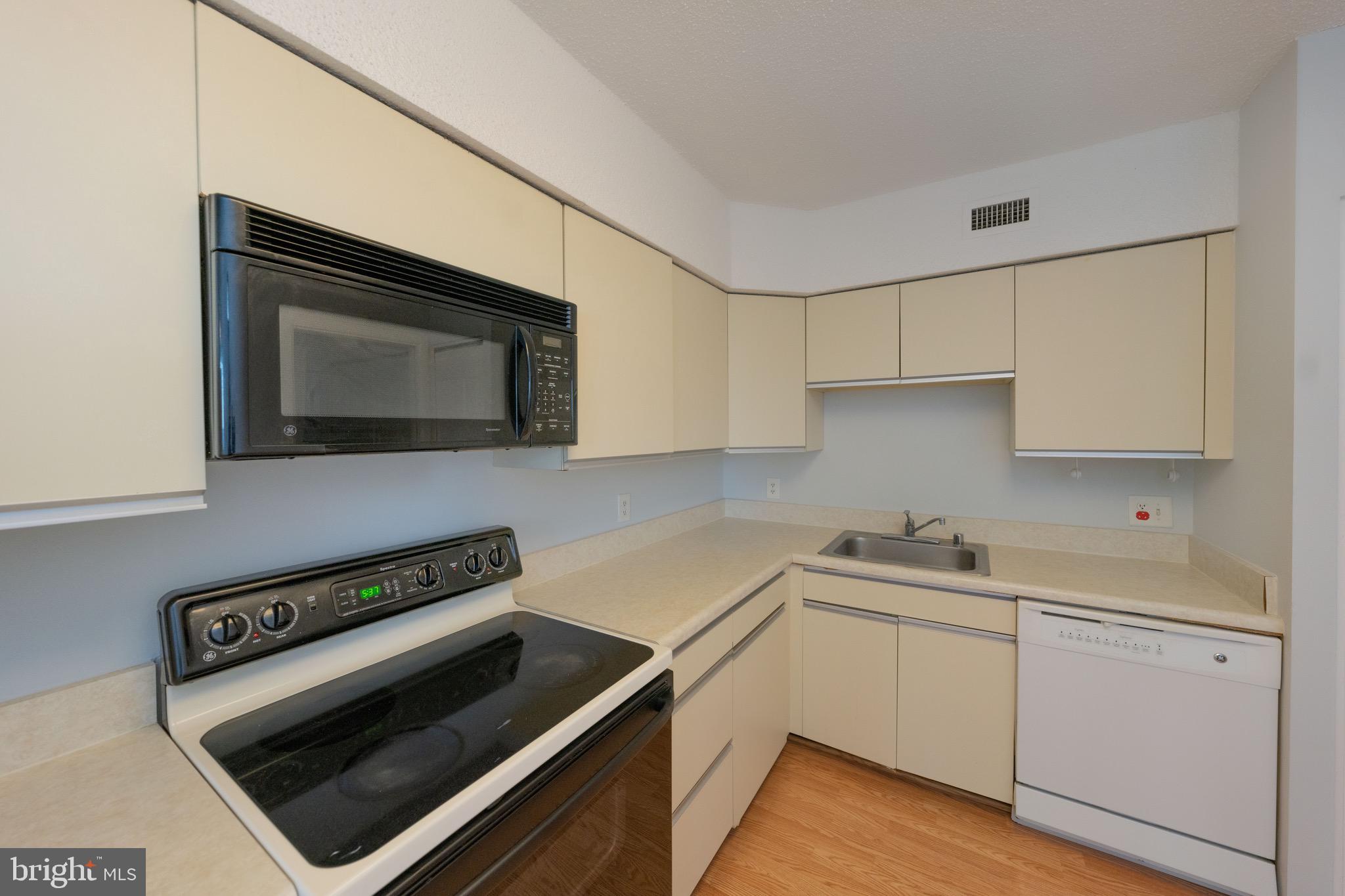 5501 Seminary Road, Unit 1113S Falls Church, VA 22041 - Photo 12 of 43 a kitchen with a stove microwave and sink