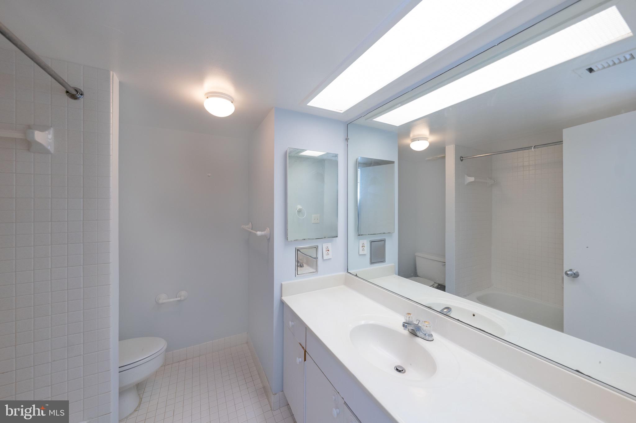 5501 Seminary Road, Unit 1113S Falls Church, VA 22041 - Photo 19 of 43 a bathroom with a bathtub shower sink vanity and toilet