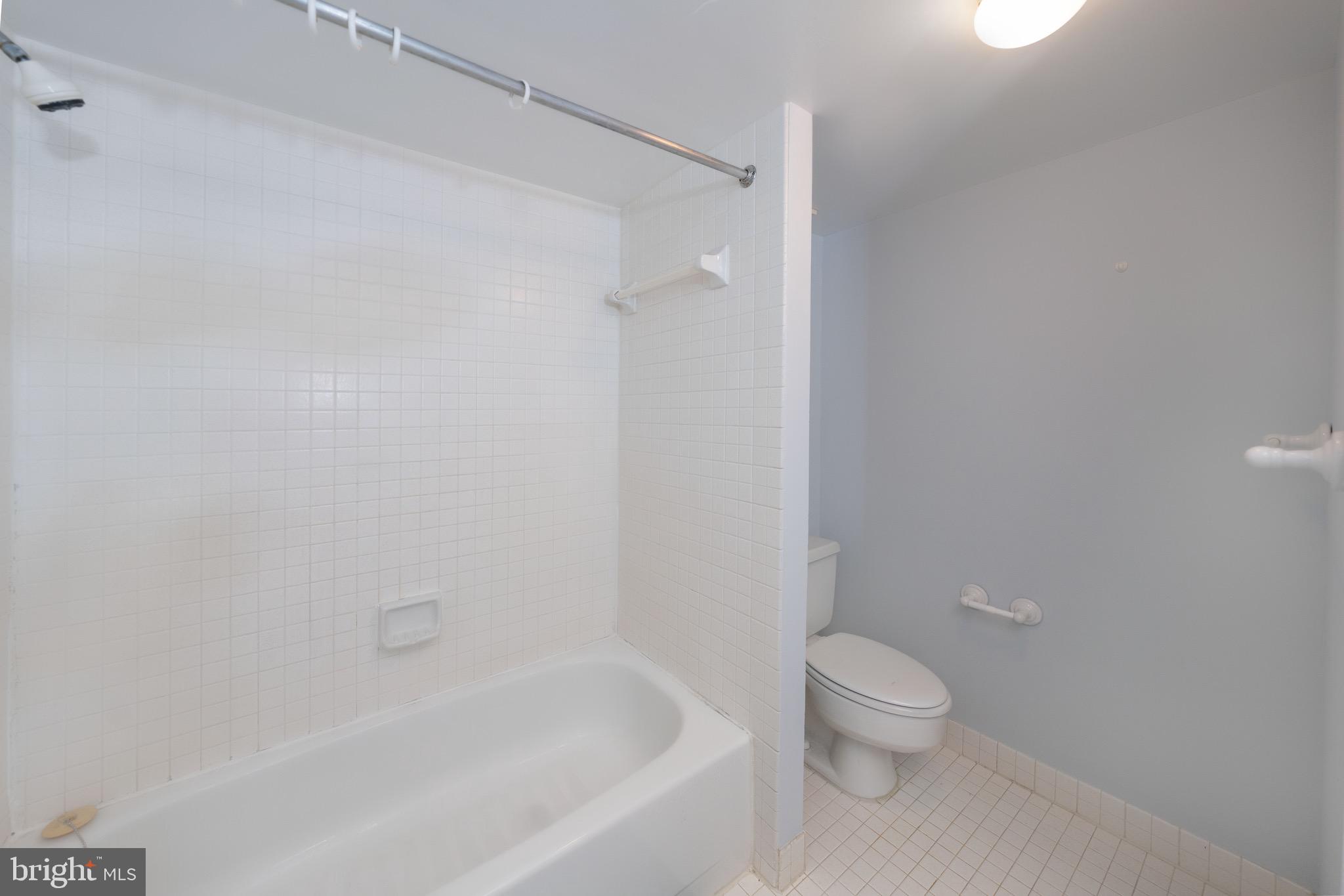 5501 Seminary Road, Unit 1113S Falls Church, VA 22041 - Photo 20 of 43 a white toilet sitting next to a bath tub