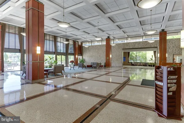 a living room with lots of furniture and a table
