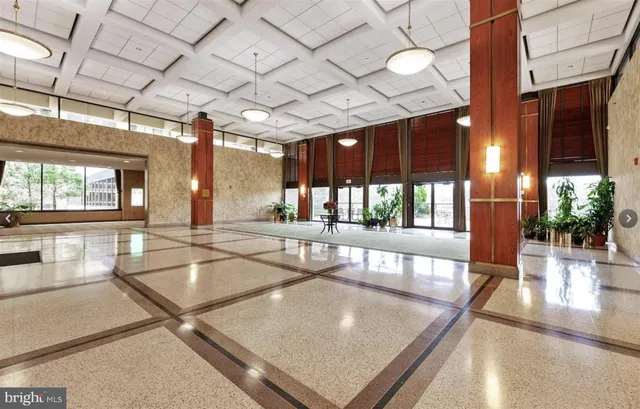 a view of lobby with furniture and large windows