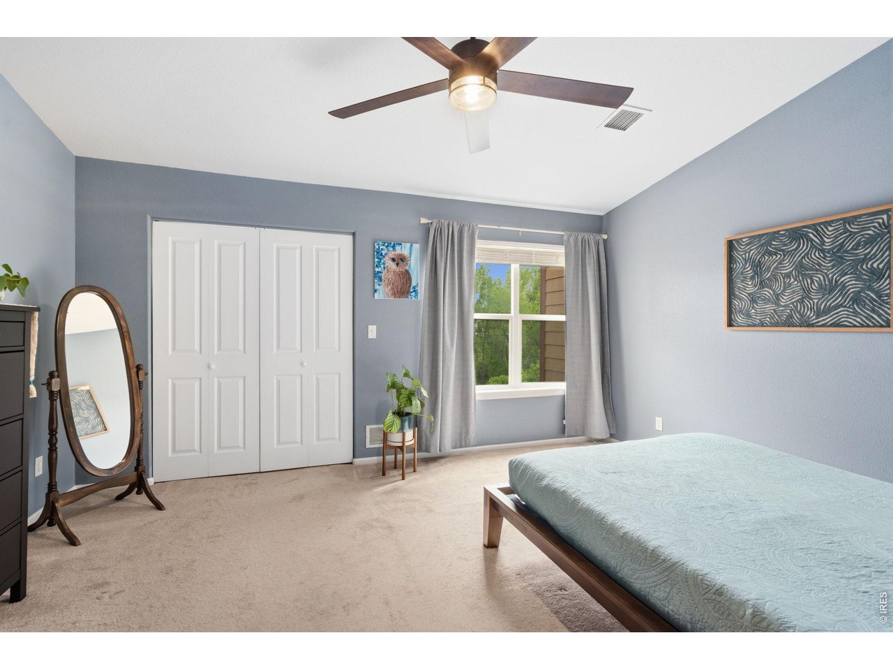 1221 East Prospect Road, Unit 3 Fort Collins, CO 80525 - Photo 20 of 37 Roomy primary bedroom with views of the natural area.