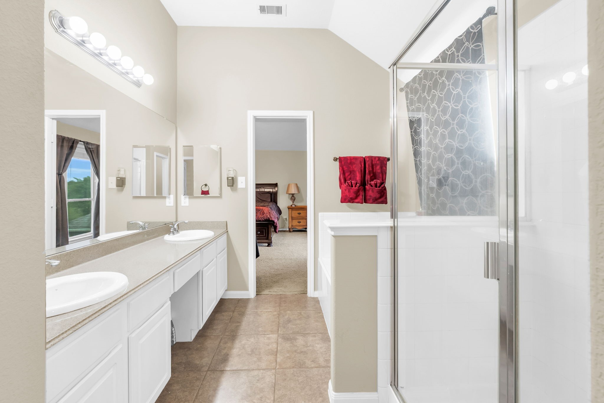 16619 Dover Mills Drive Spring, TX 77379 - Photo 29 of 49 a bathroom with a tub sink and mirror