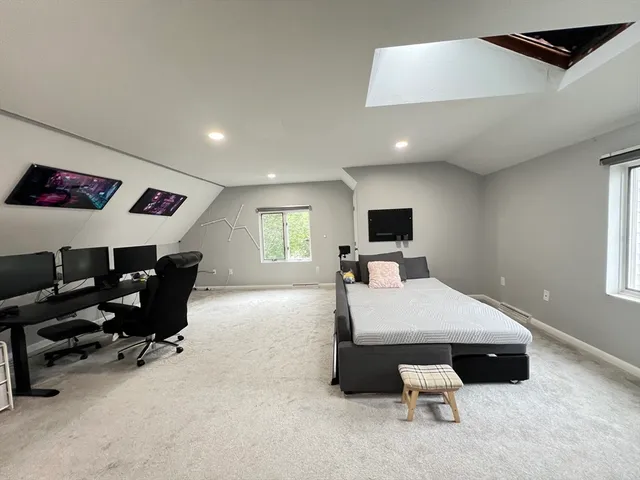 a room with furniture and a flat screen tv