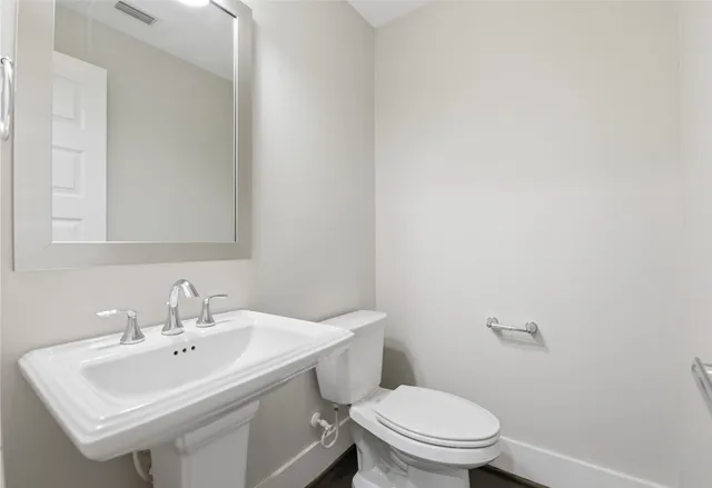 a view of a patio with table and chairs and potted plants
