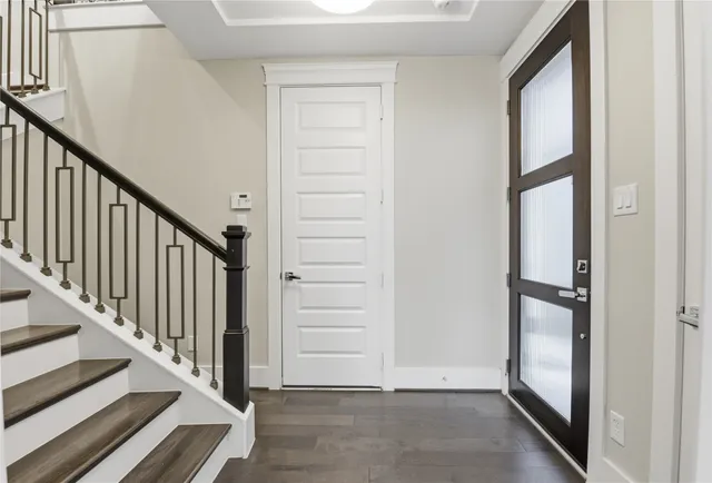 a bathroom with a sink a toilet a mirror and vanity