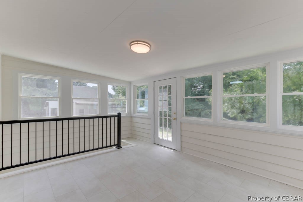 400 Showalter Road Yorktown, VA 23692 - Photo 40 of 49 Unfurnished sunroom featuring vaulted ceiling and a healthy amount of sunlight