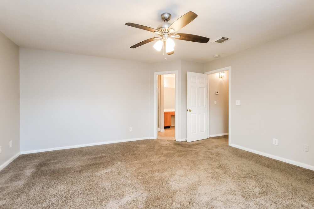 3219 Candlepine Drive Spring, TX 77388 - Photo 11 of 16 an empty room with a ceiling fan and a window