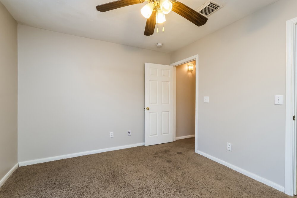 3219 Candlepine Drive Spring, TX 77388 - Photo 14 of 16 an empty room with a ceiling fan and a window