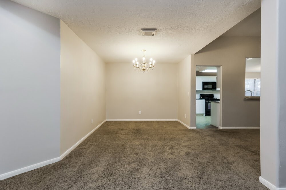 3219 Candlepine Drive Spring, TX 77388 - Photo 6 of 16 an empty room with mirror and entrance