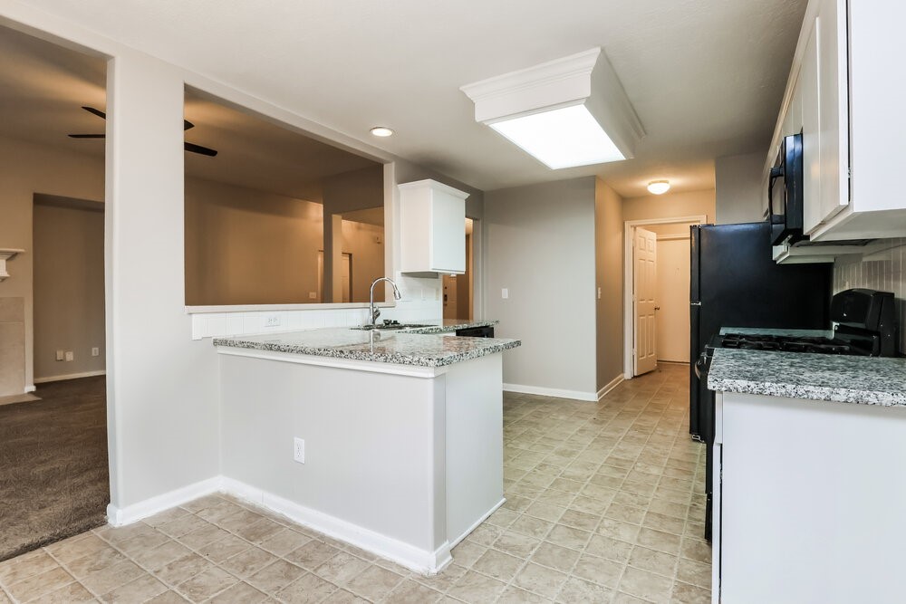 3219 Candlepine Drive Spring, TX 77388 - Photo 8 of 16 a bathroom with a granite countertop sink and a mirror