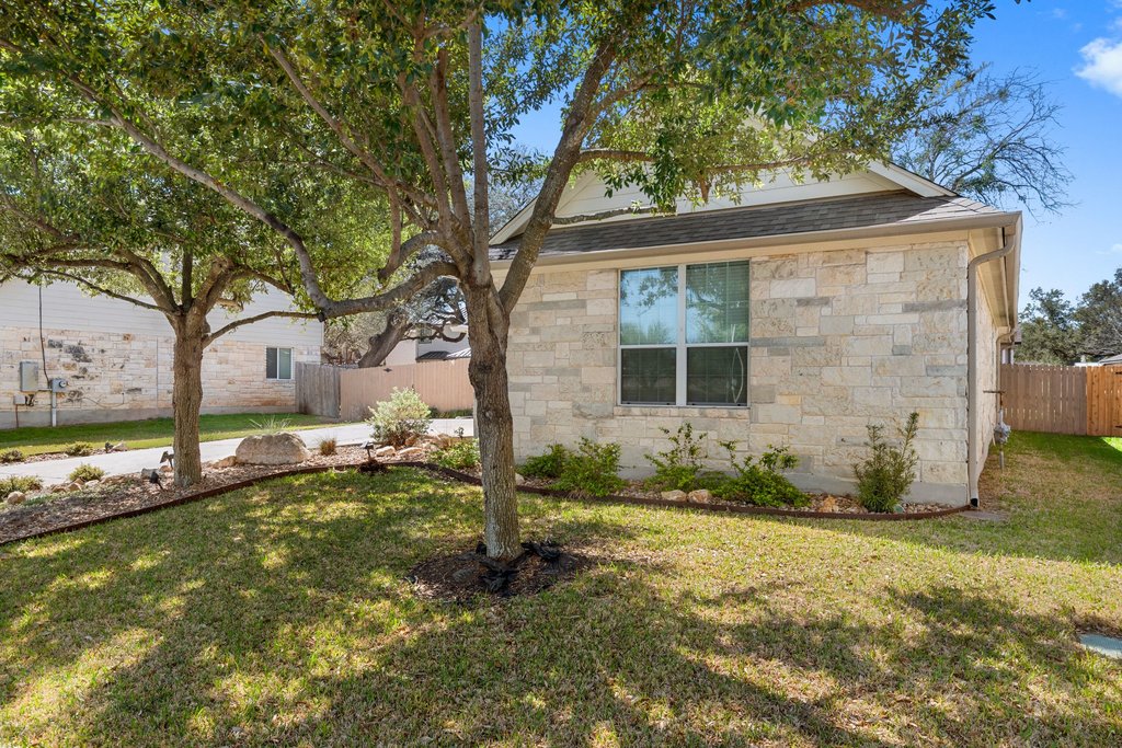 322 River Bluff Circle Georgetown, TX 78626 - Photo 32 of 35 a front view of a house with garden