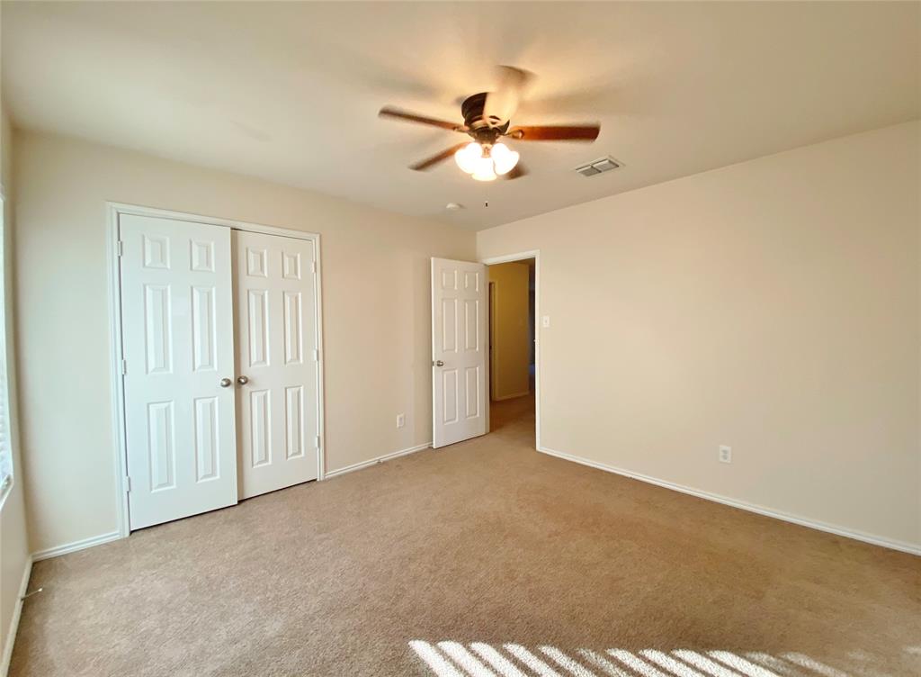 5511 Green Ivy Road Denton, TX 76210 - Photo 10 of 12 a view of an empty room