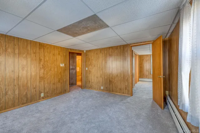 a view of an empty room and a window