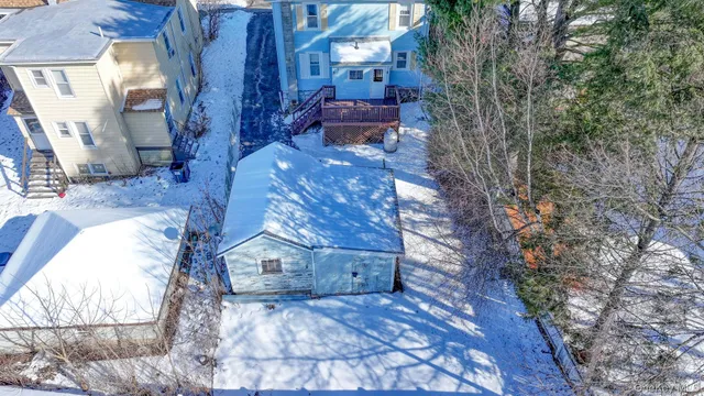 a view of an chairs in the backyard