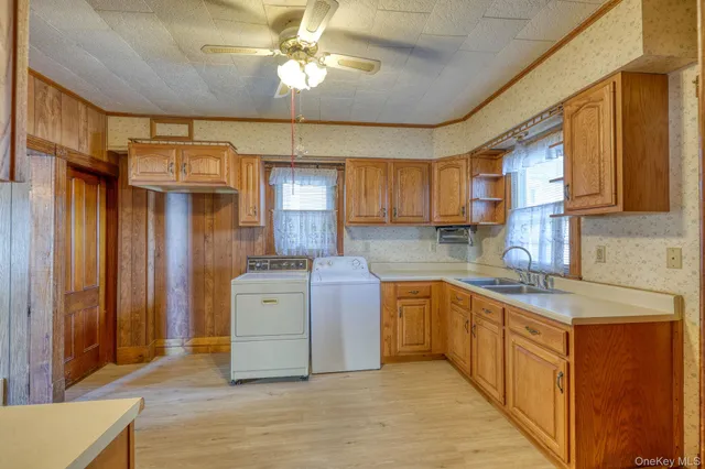 a kitchen with a stove a sink and a refrigerator