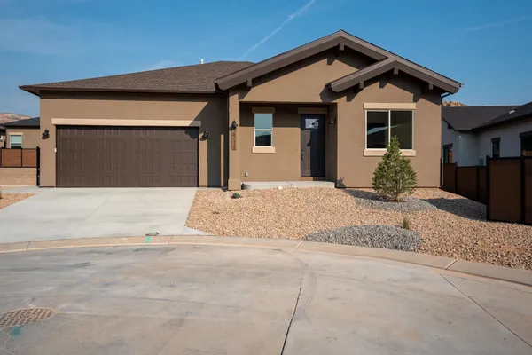 a front view of a house with a outdoor space