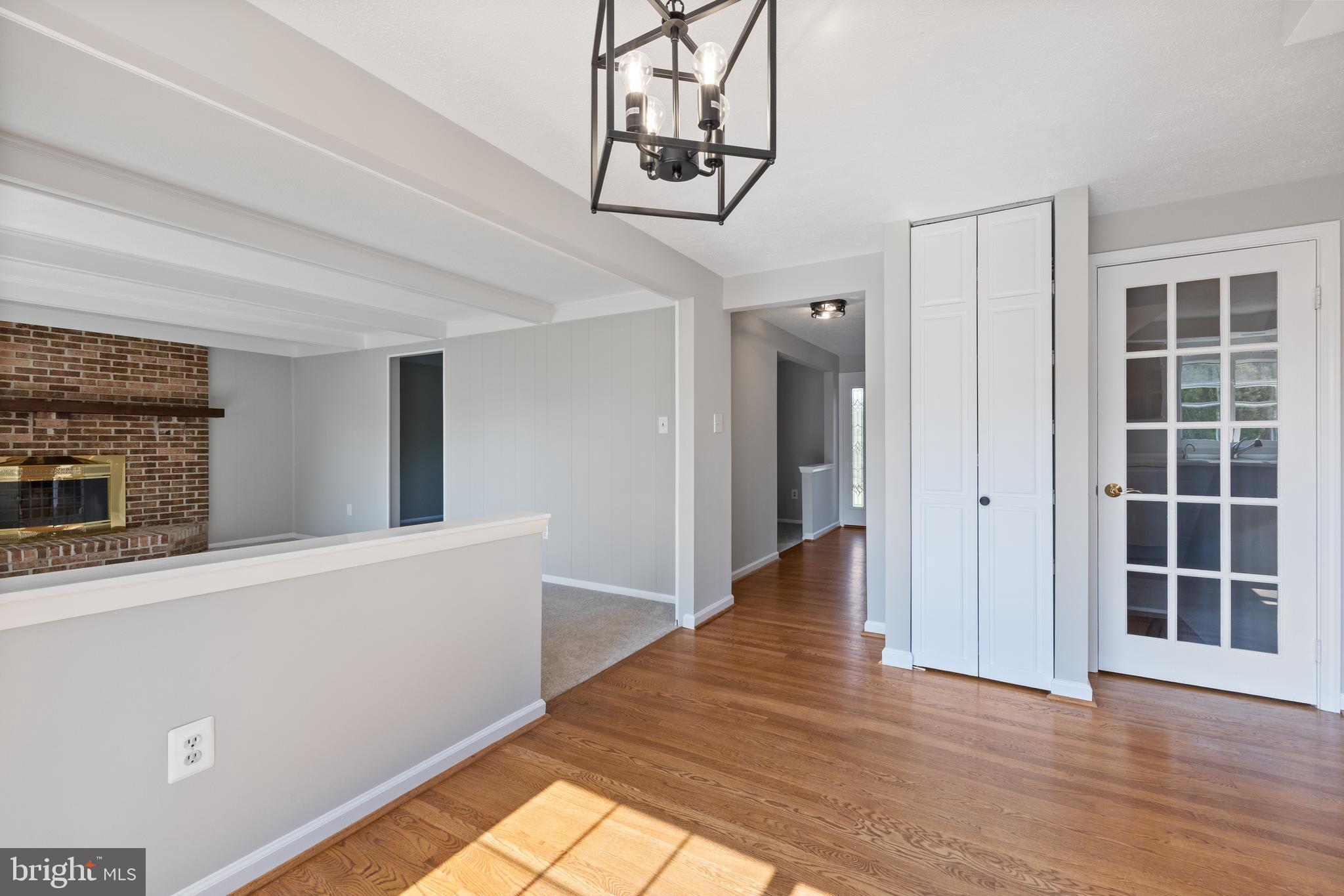 22000 Goshen School Road Gaithersburg, MD 20882 - Photo 18 of 57 a view of a hallway with wooden floor and staircase