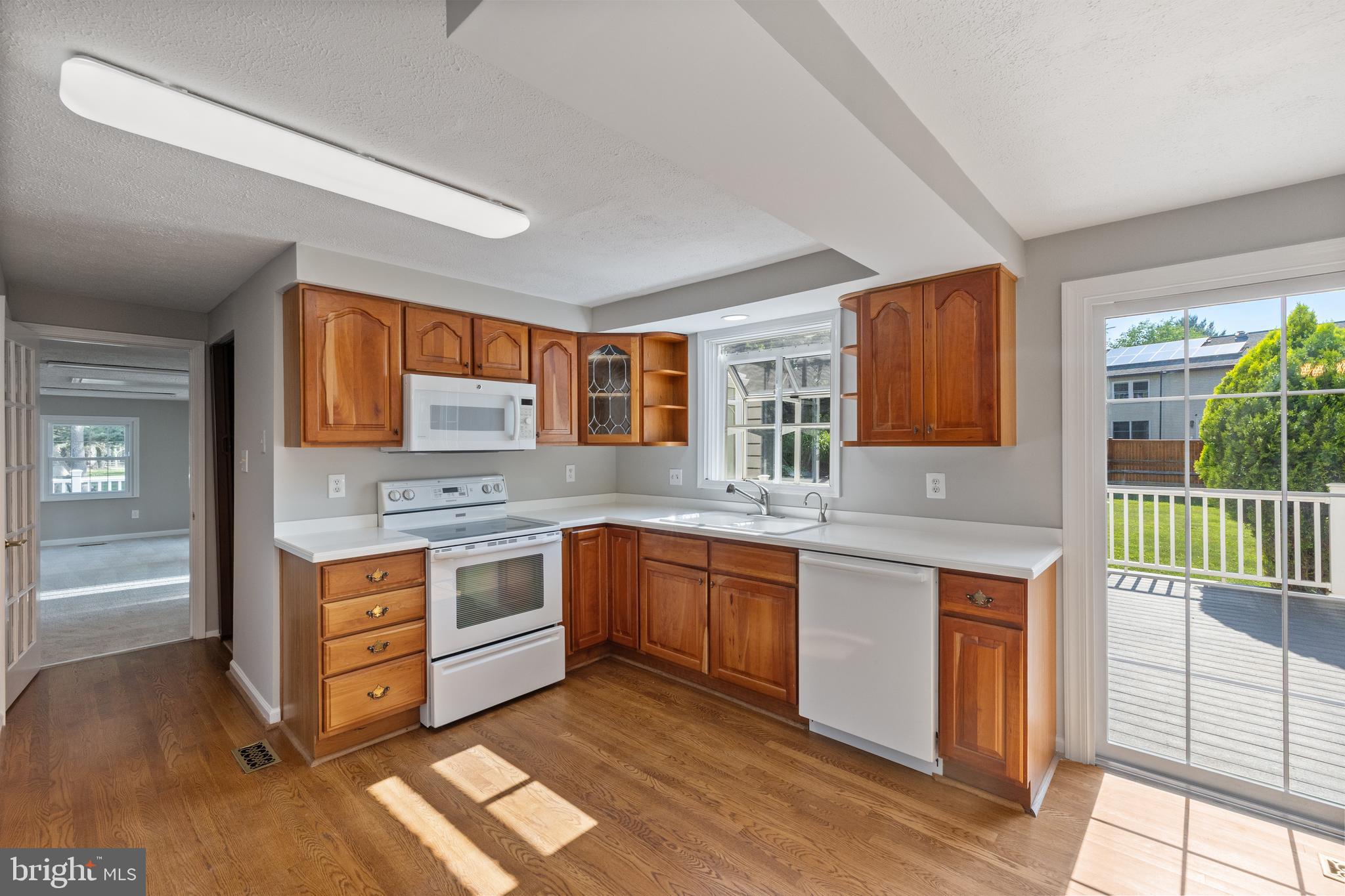 22000 Goshen School Road Gaithersburg, MD 20882 - Photo 20 of 57 a kitchen with stainless steel appliances granite countertop a stove and cabinets