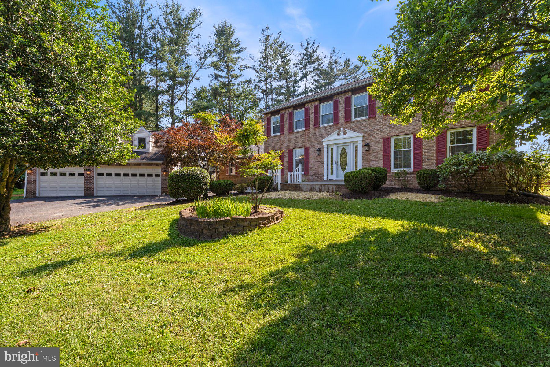 22000 Goshen School Road Gaithersburg, MD 20882 - Photo 2 of 57 a view of a house with a yard and tree s