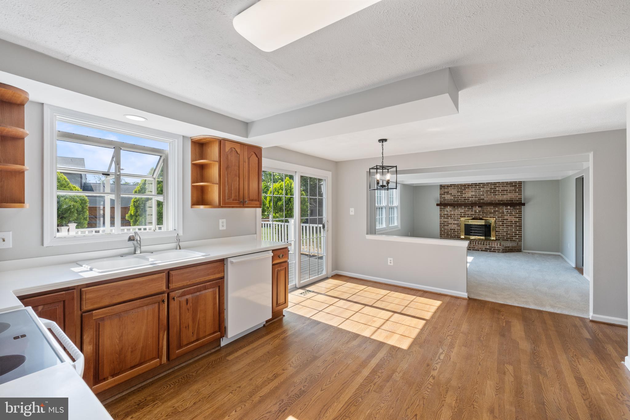 22000 Goshen School Road Gaithersburg, MD 20882 - Photo 21 of 57 a large kitchen with granite countertop a stove and a sink