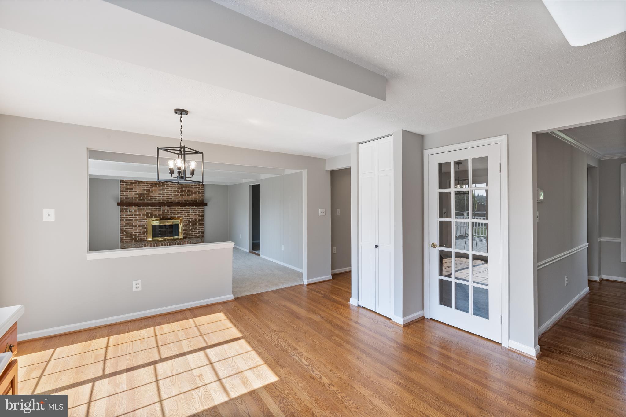 22000 Goshen School Road Gaithersburg, MD 20882 - Photo 22 of 57 a view of an empty room with window and wooden floor