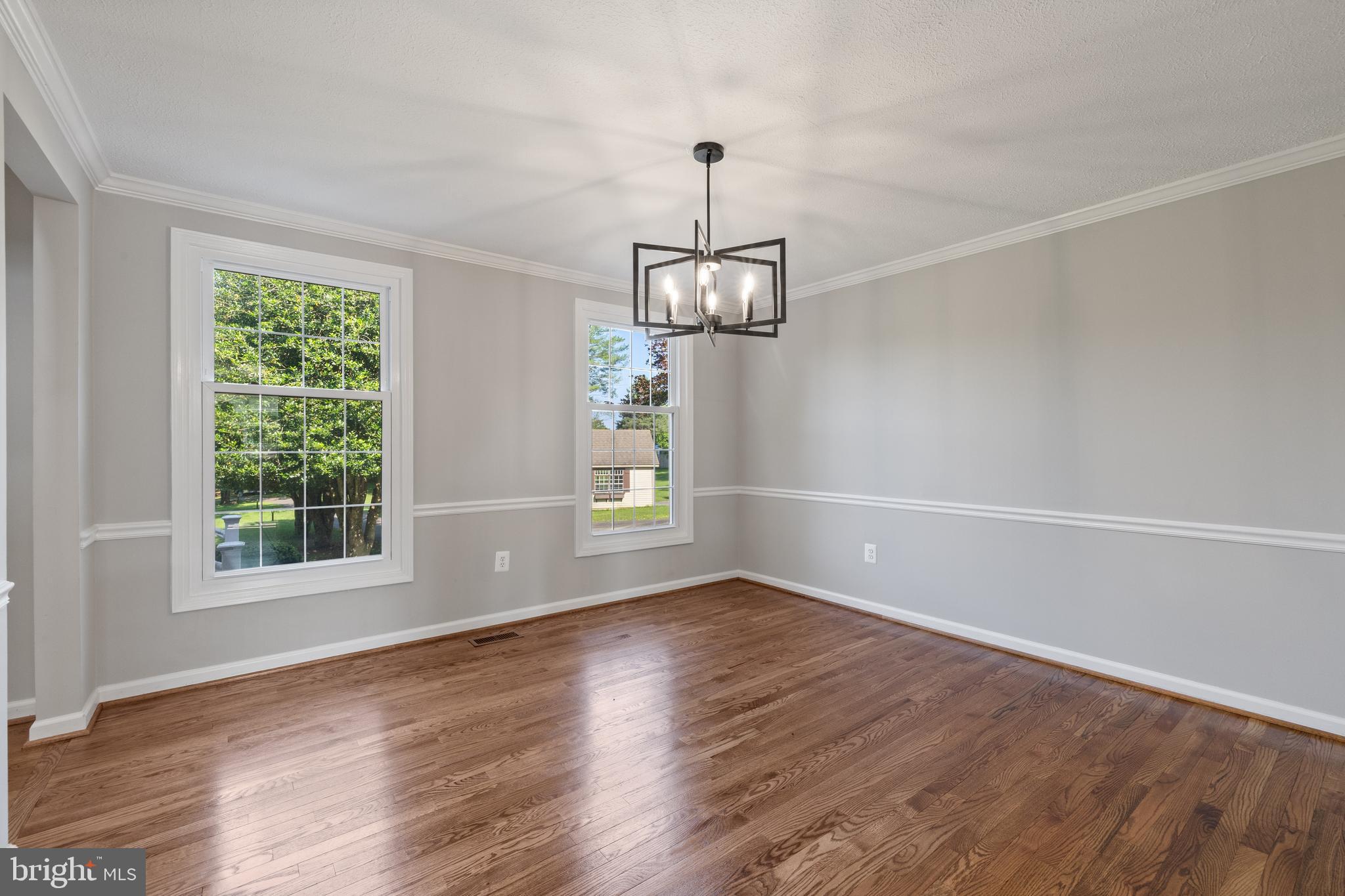 22000 Goshen School Road Gaithersburg, MD 20882 - Photo 23 of 57 an empty room with wooden floor and windows