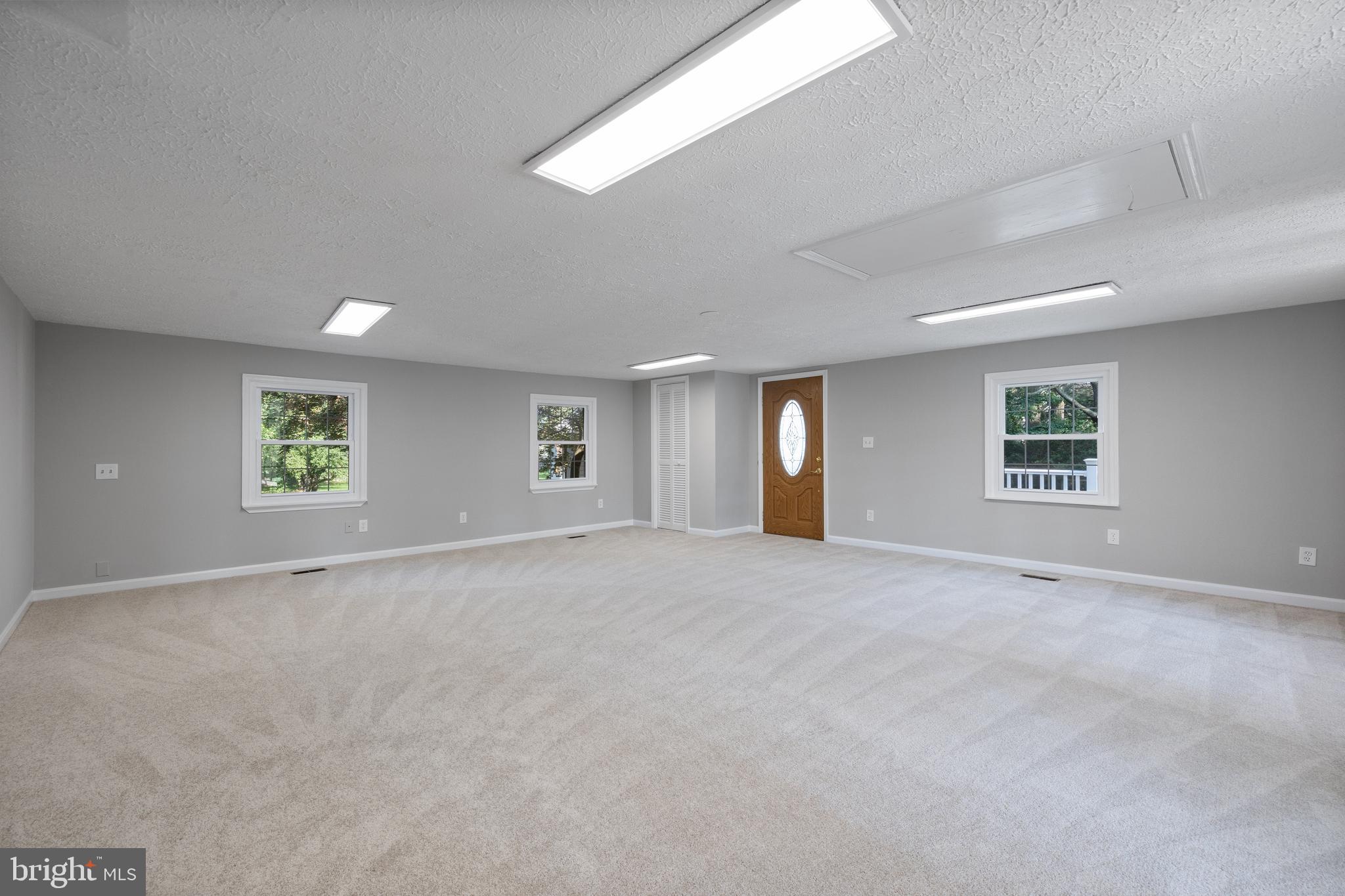 22000 Goshen School Road Gaithersburg, MD 20882 - Photo 27 of 57 an empty room with a window and a ceiling fan