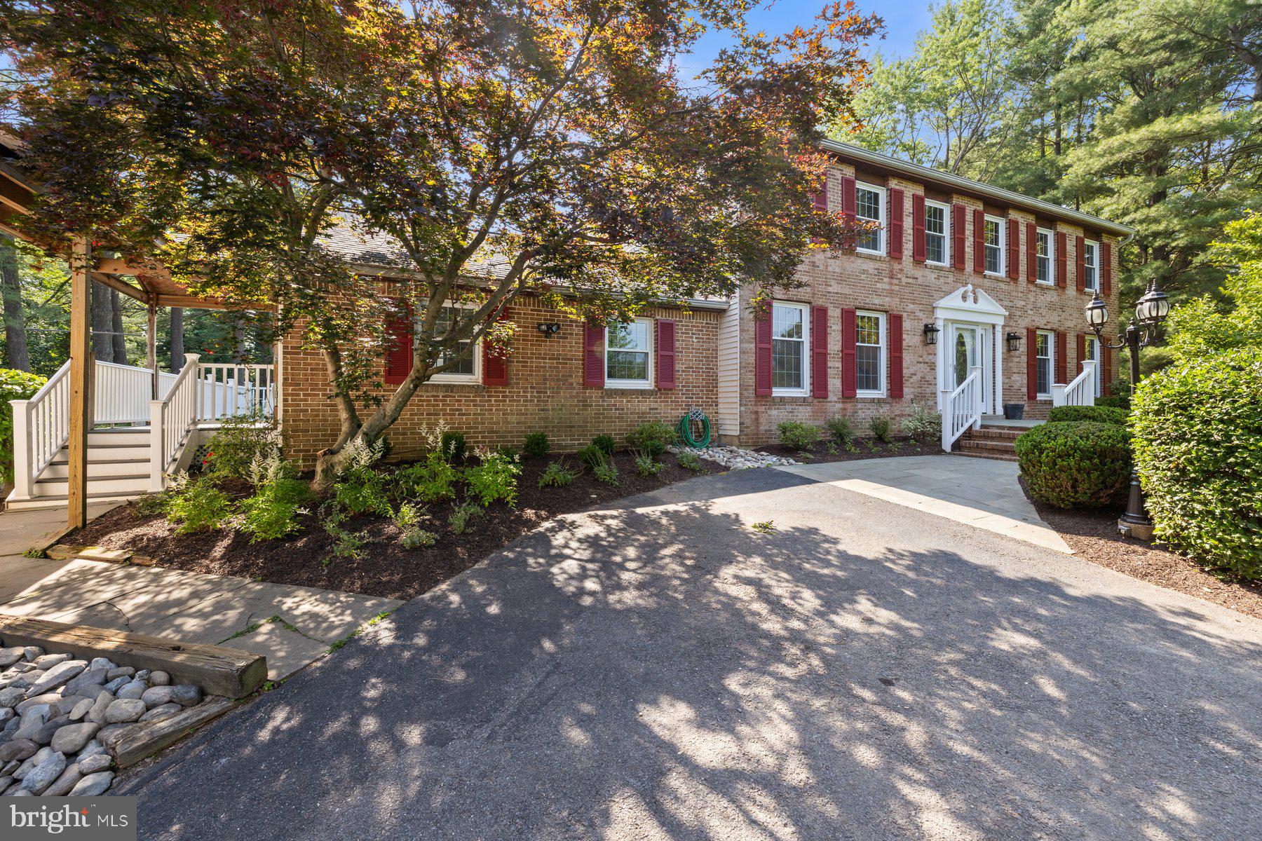 22000 Goshen School Road Gaithersburg, MD 20882 - Photo 3 of 57 a front view of a house with garden