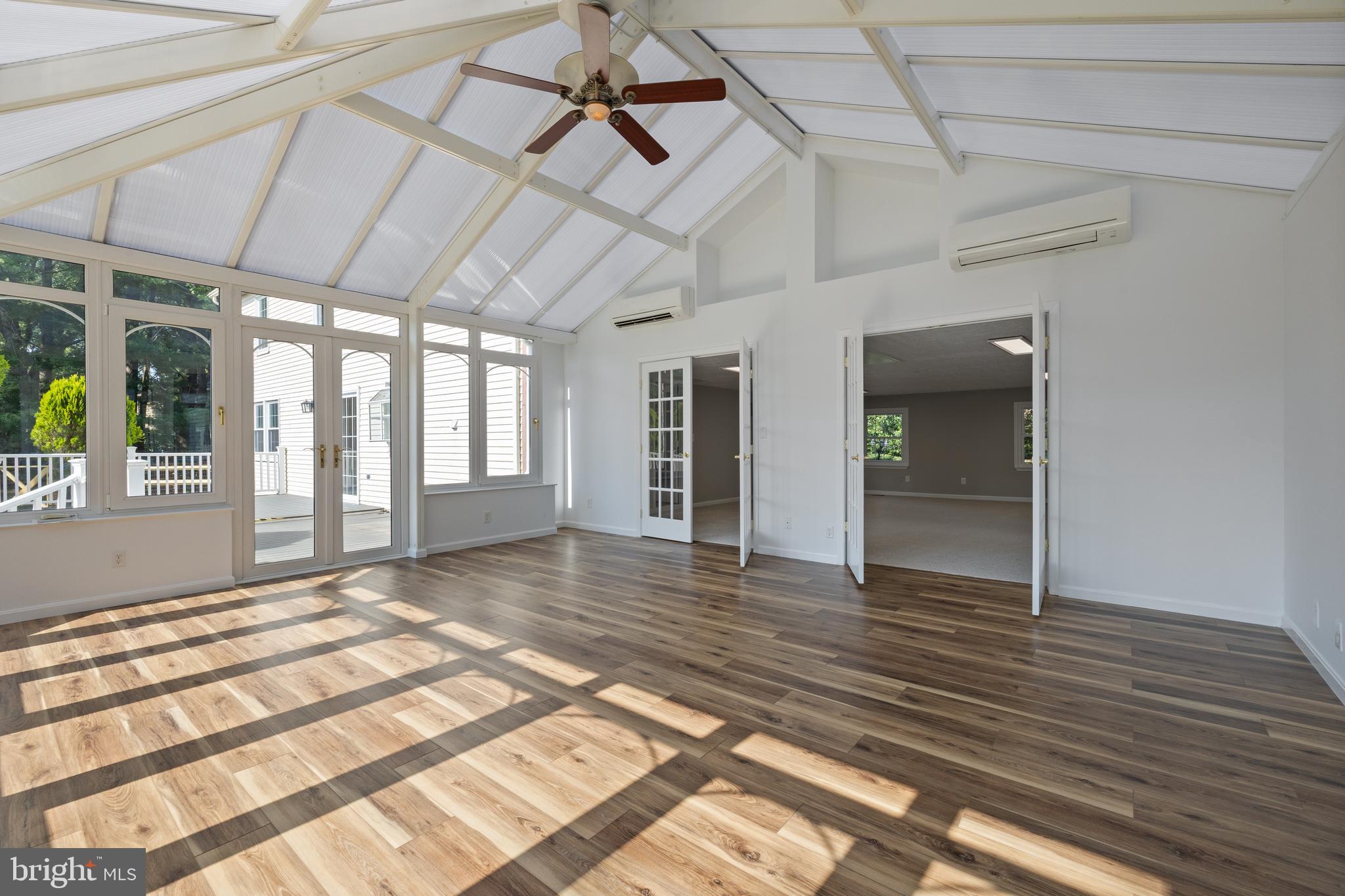 22000 Goshen School Road Gaithersburg, MD 20882 - Photo 31 of 57 a view of an empty room with wooden floor and a window
