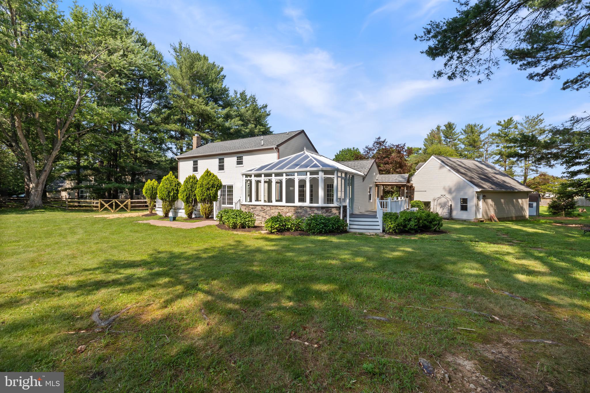 22000 Goshen School Road Gaithersburg, MD 20882 - Photo 5 of 57 a front view of a house with a yard
