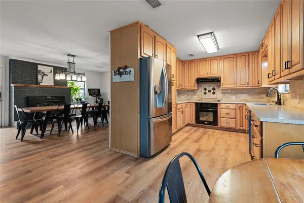 a bedroom with a bed and a chair