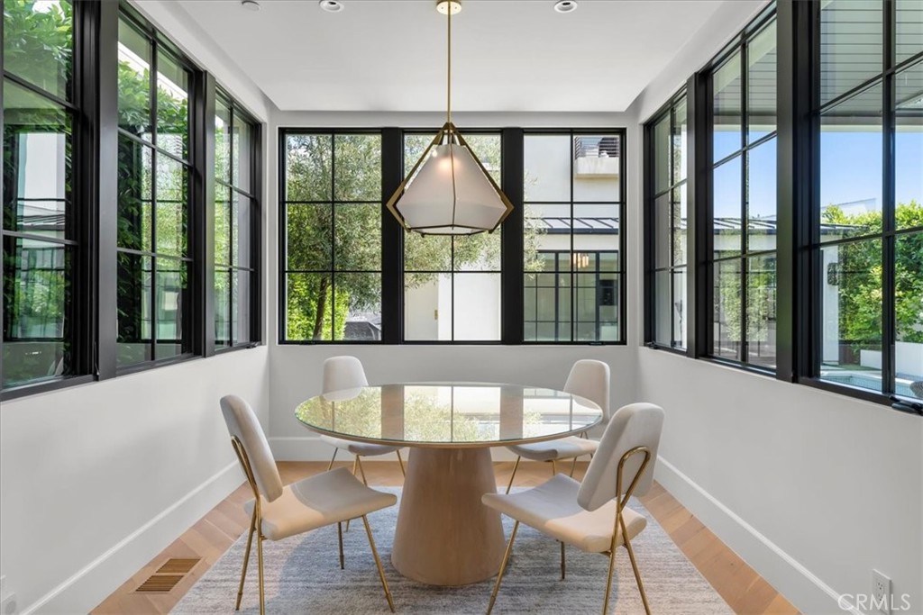 604 14th Street Manhattan Beach, CA 90266 - Photo 11 of 43 a view of a dining room with furniture large windows and wooden floor