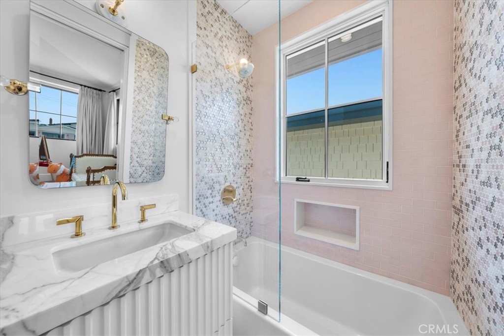 604 14th Street Manhattan Beach, CA 90266 - Photo 31 of 43 a bathroom with a granite countertop sink and a bathtub