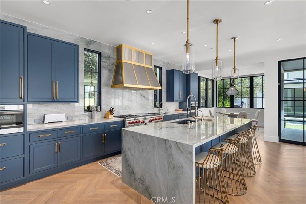 604 14th Street Manhattan Beach, CA 90266 - Photo 9 of 43 a kitchen with kitchen island granite countertop a sink counter top space and cabinets