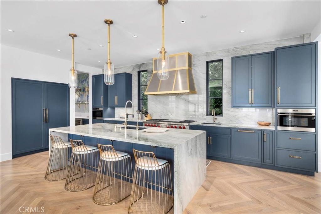 604 14th Street Manhattan Beach, CA 90266 - Photo 10 of 43 a kitchen with a stove a sink and cabinetry