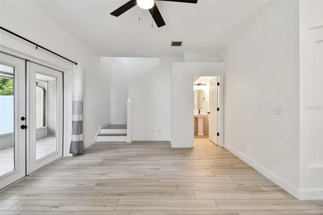 a view of livingroom with hardwood floor and a ceiling fan