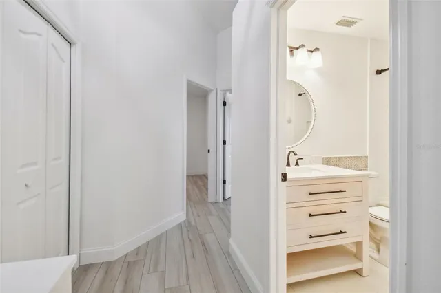 a view of room with wooden floor