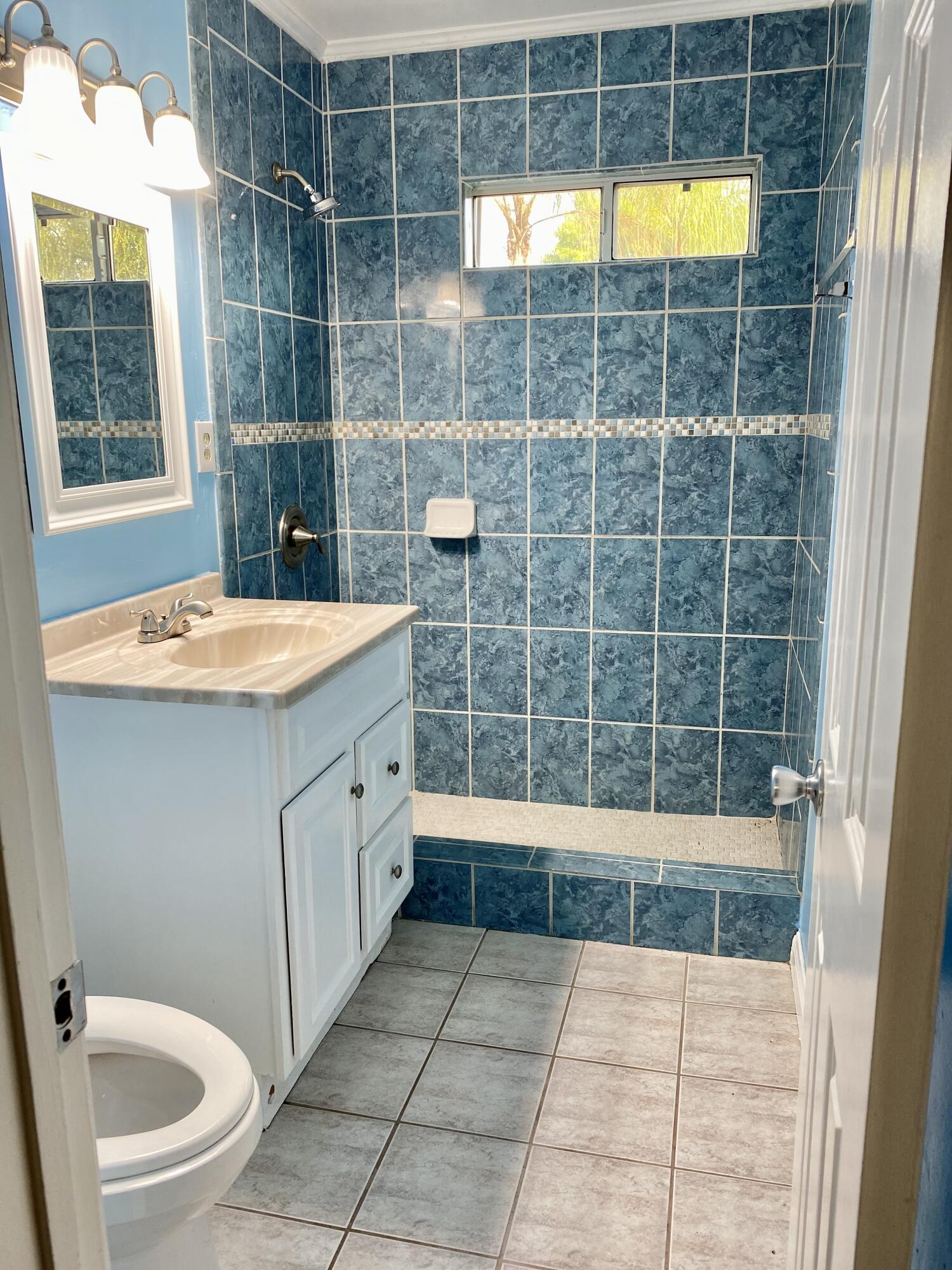 6916 Azalea Avenue Bakersfield, CA 93306 - Photo 11 of 26 a bathroom with a tub a toilet a sink and shower