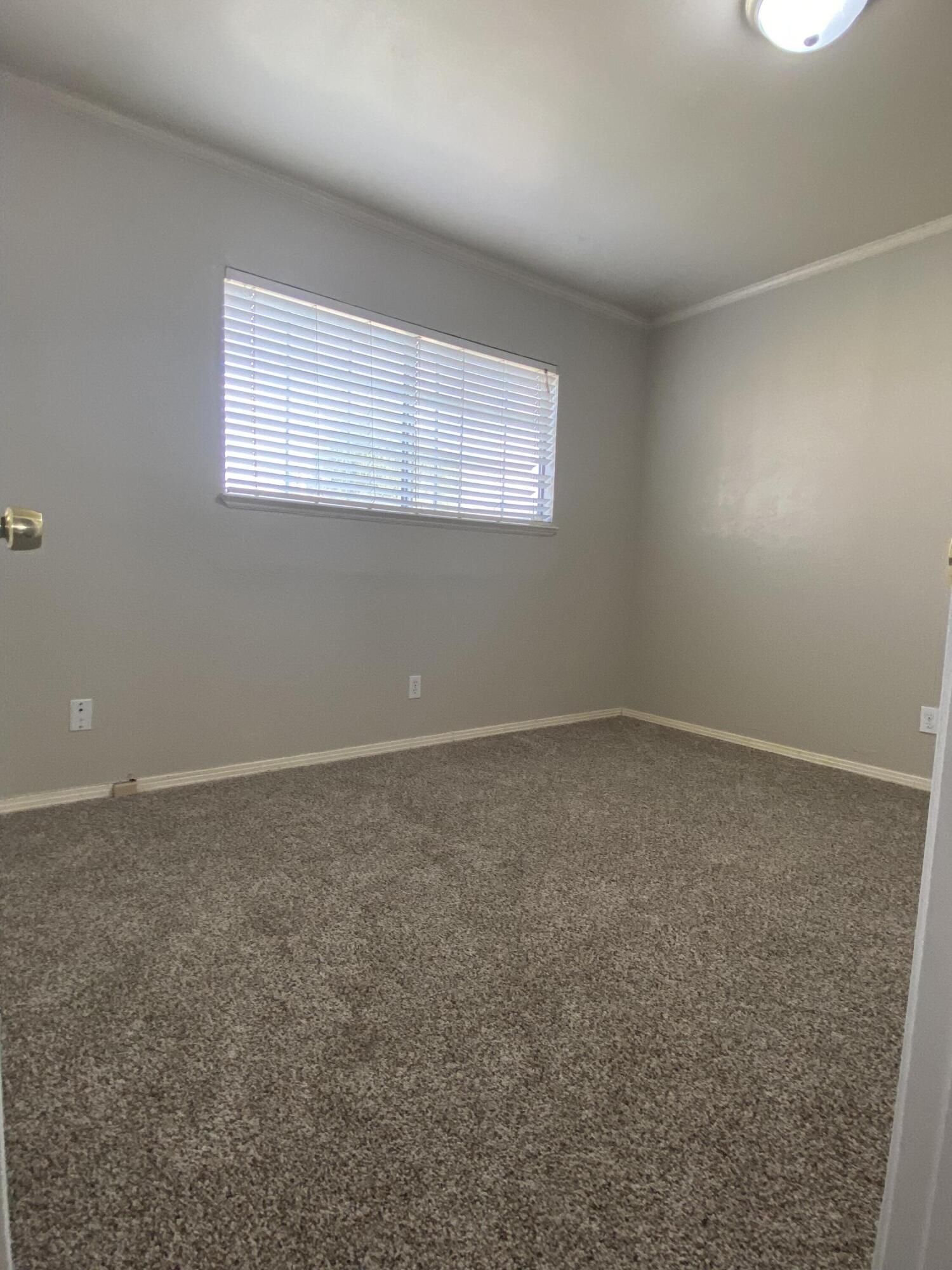 6916 Azalea Avenue Bakersfield, CA 93306 - Photo 12 of 26 an empty room with windows