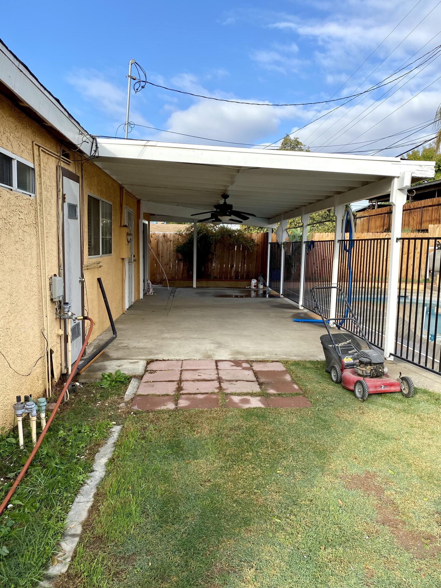 6916 Azalea Avenue Bakersfield, CA 93306 - Photo 20 of 26 a view of a backyard with table and chairs
