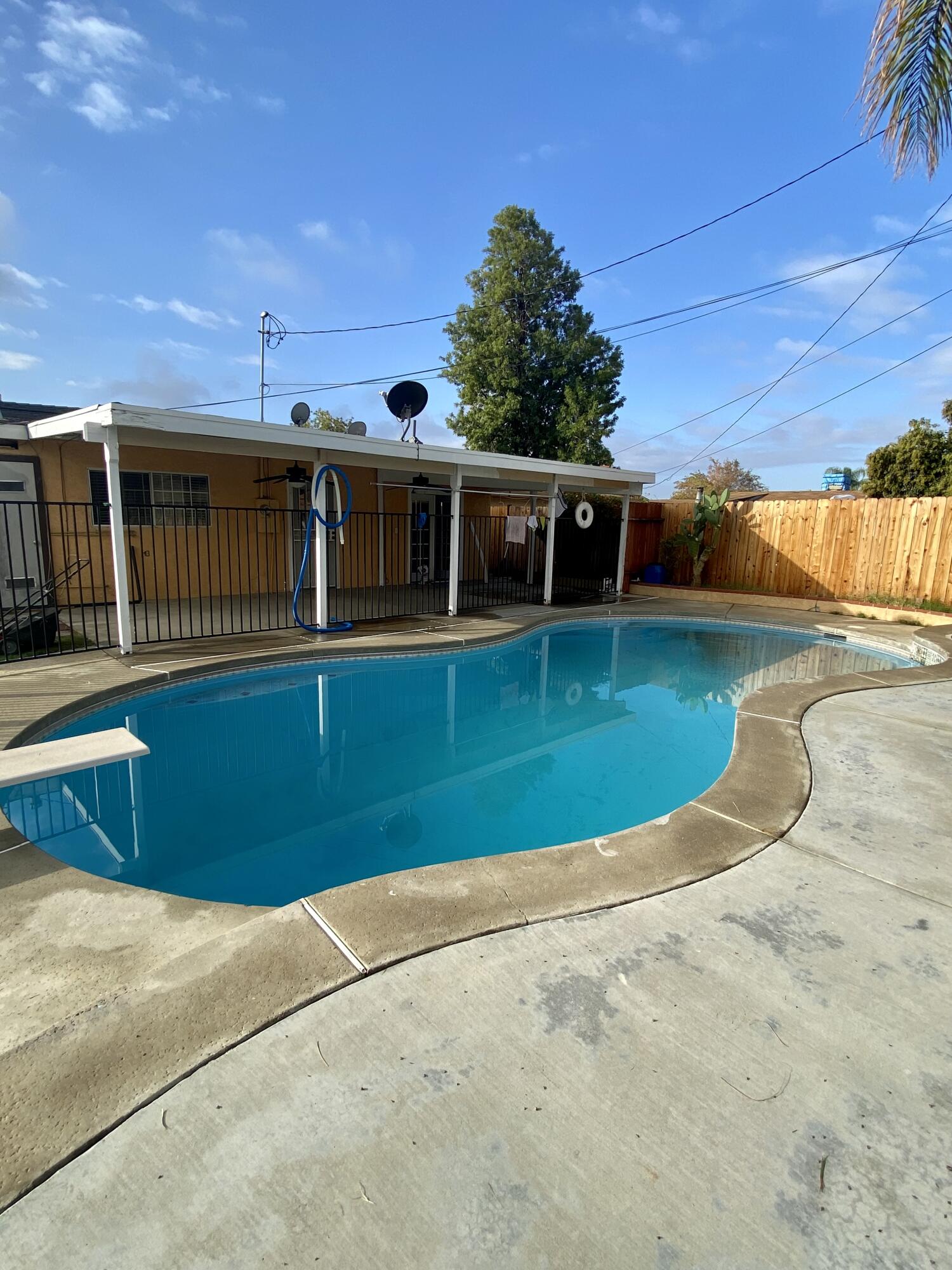 6916 Azalea Avenue Bakersfield, CA 93306 - Photo 22 of 26 front view of a house with a yard
