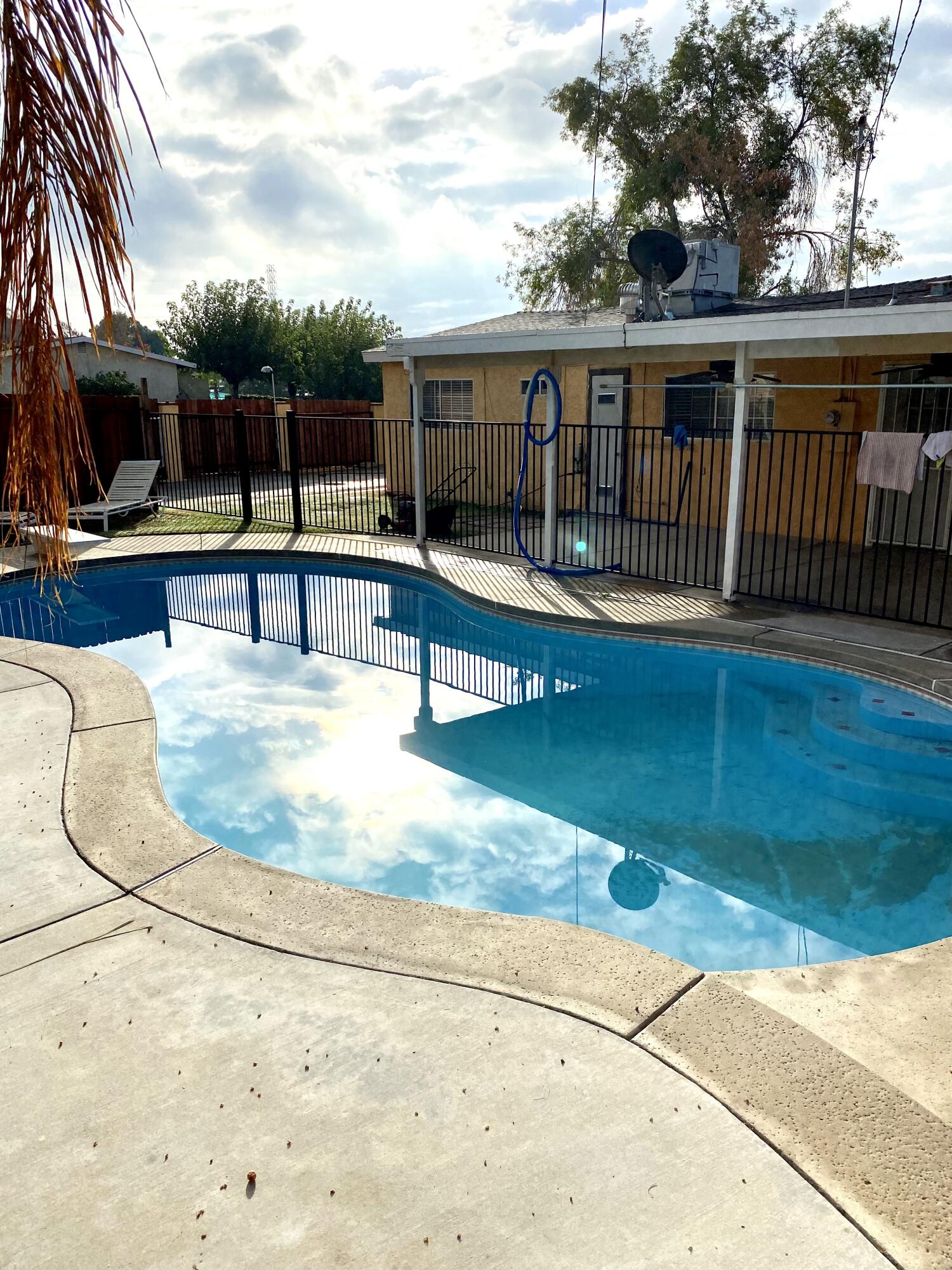 6916 Azalea Avenue Bakersfield, CA 93306 - Photo 24 of 26 a view of roof deck with a barbeque and wooden fence